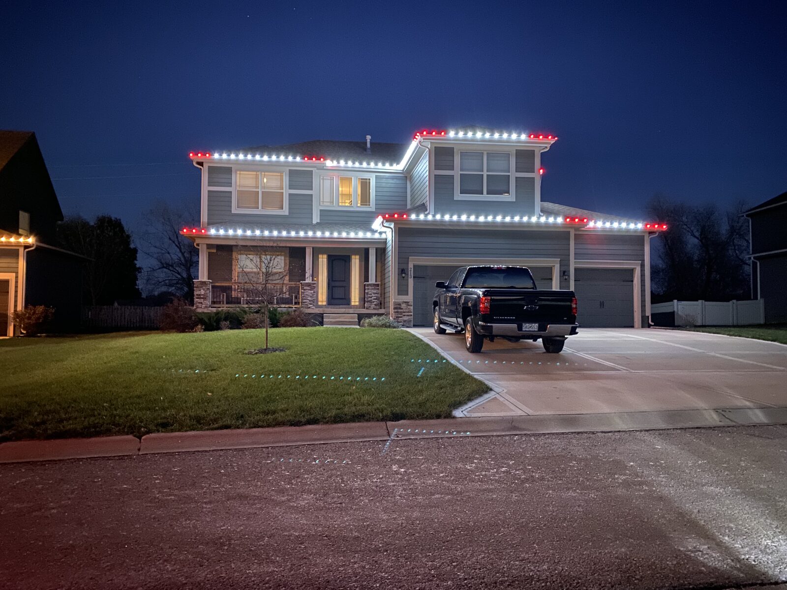 Christmas light installation by Reign Enterprises — C9 LED roofline display