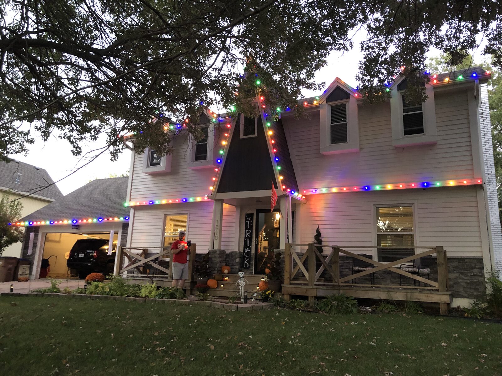 Professional holiday lighting on residential home — warm color display