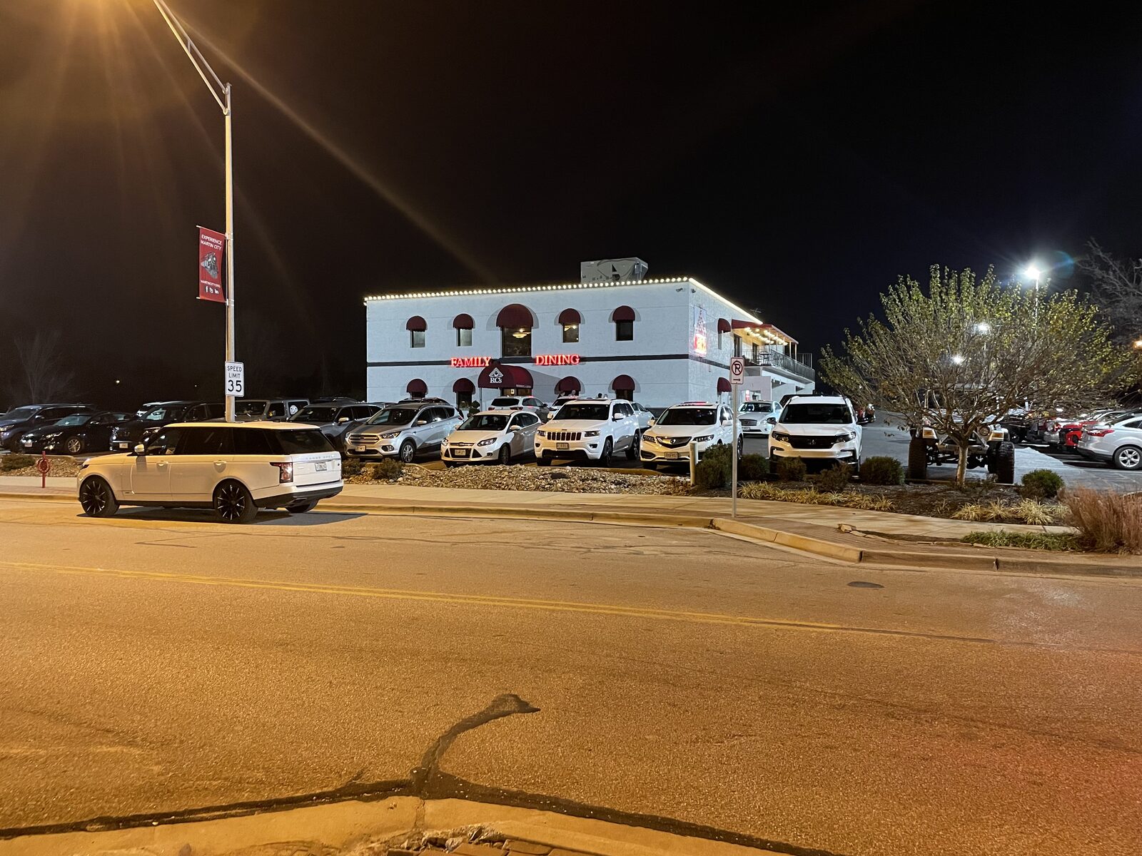 Christmas light installation close-up — C9 LED bulbs on roofline